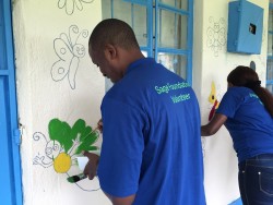 Sage volunteers painting the Compassionate Hands for the Disabled Organisation 1.JPG