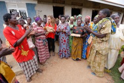 Dr. Rasha Kelej and minister Sarah Opendi with  Infertile women after empowing them with small busin