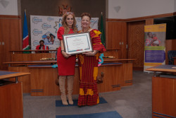 Dr. Rasha Kelej CEO Merck Foundation presenting the certificate to Hon. Margaret Mensah-Williams, as