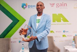 Ope Olanrewaju, Kennie-O Cold Chain Logistics holds the Grand Prize trophy for the SUN Pitch Competi