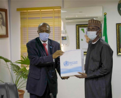 WR making a presentation to the Minister of FCT 3.jpg