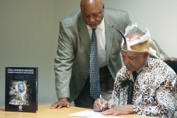 Khoisan King Brown, with Rev Fred Shaw of CCHR, signs Tribal Resolution denoucing psychiatric druggi