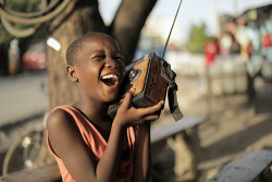 Girl listen to Ubongo Kids radio.jpg