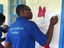 Sage volunteers painting the Compassionate Hands for the Disabled Organisation 2.JPG