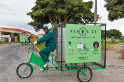 Waste collector at Regenize, South Africa.jpg