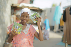 Girl-showing-off-Ubongo-dvd (1).jpg